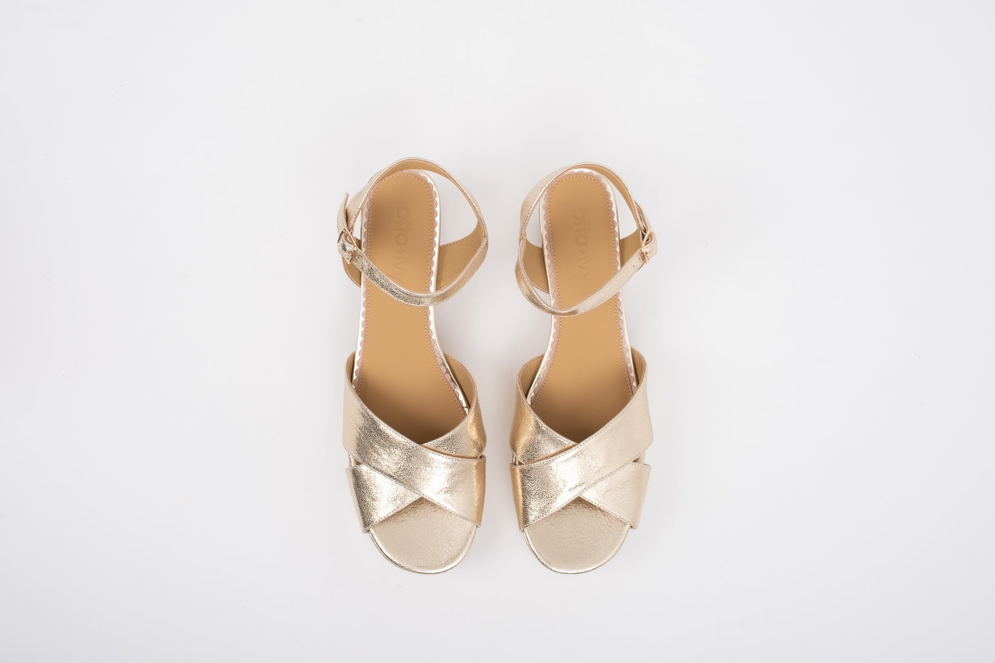 Aerial shot of womens large size gold block heeled sandal in sizes 8 9 10 11 12 
