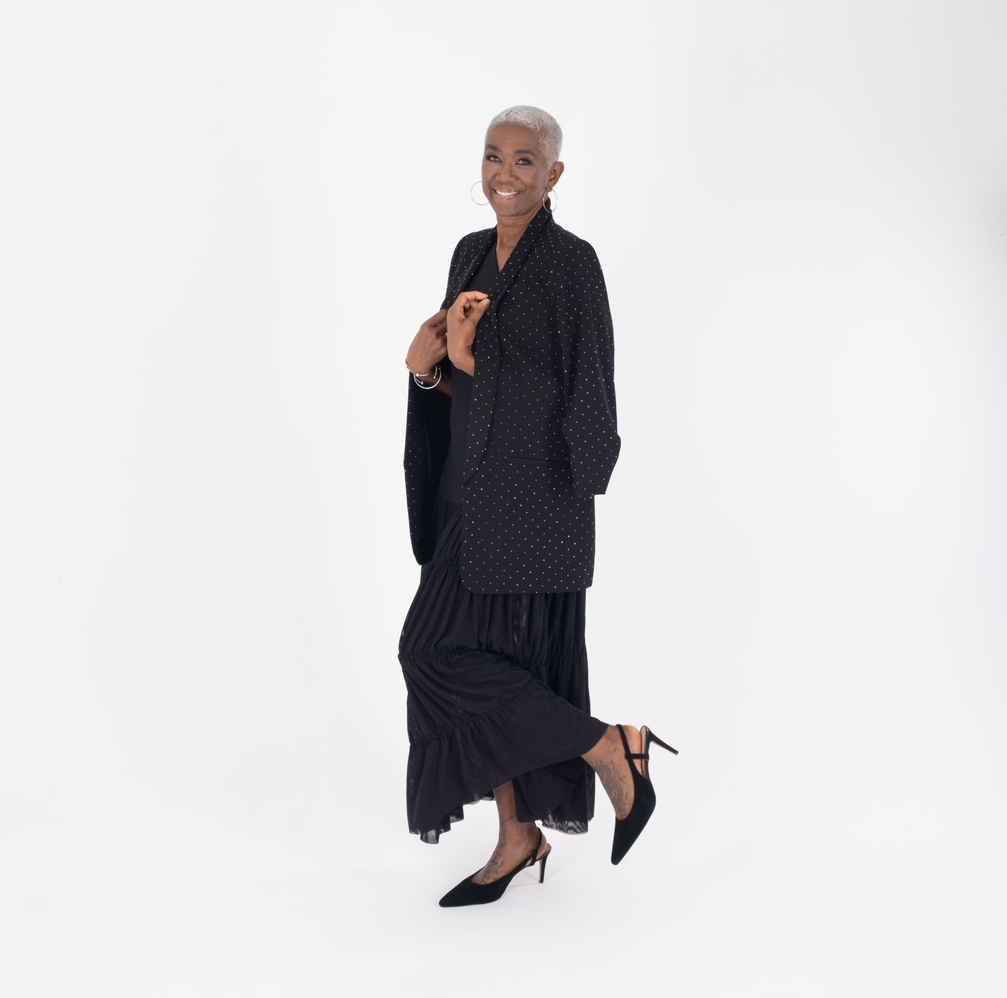 Woman modelling black heeled slingback shoes available in lager sizes 42-46 standard and wide fit.