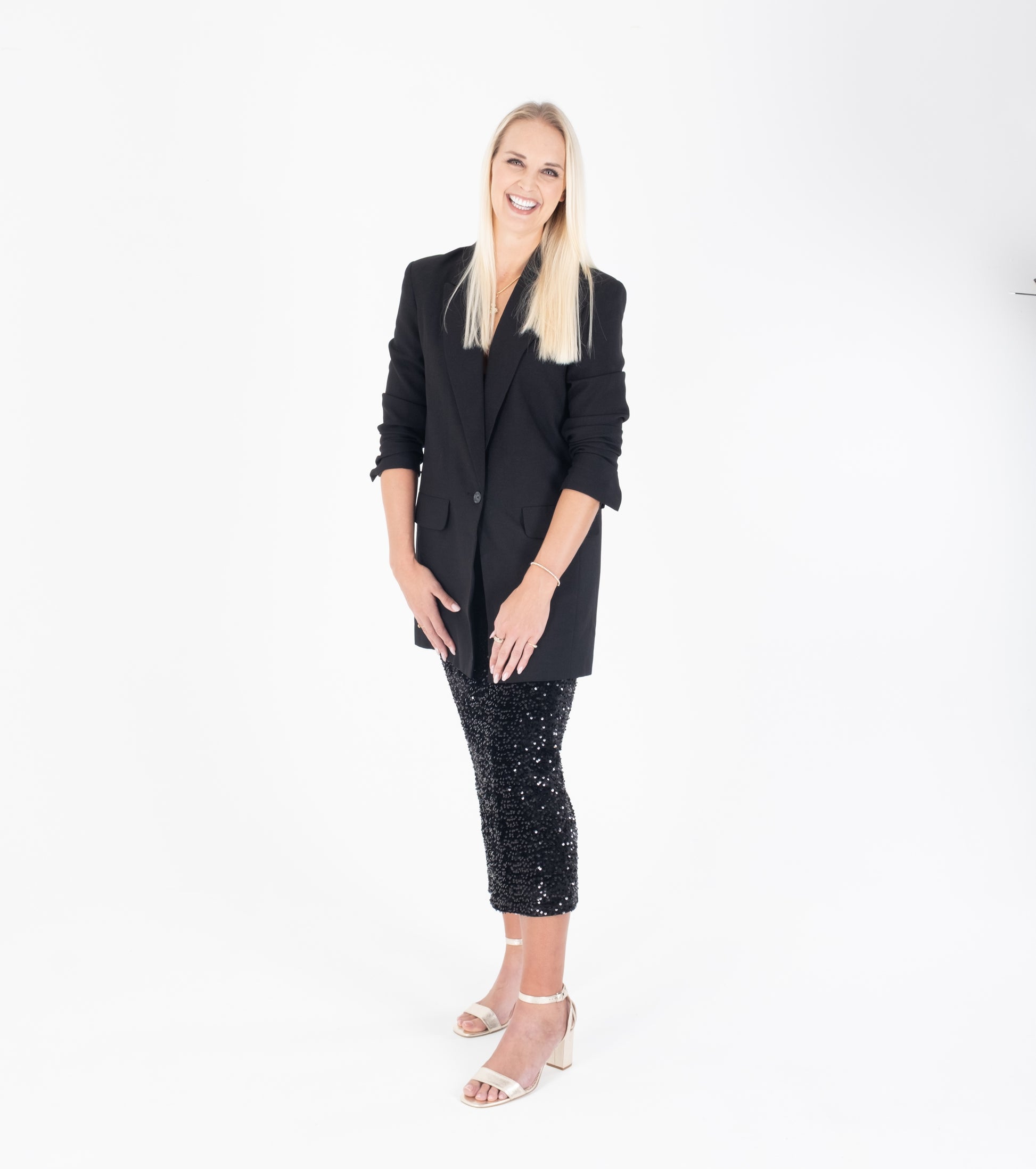 Tall woman modelling gold scrappy heeled sandal in larger sizes 42 43 44 45 46