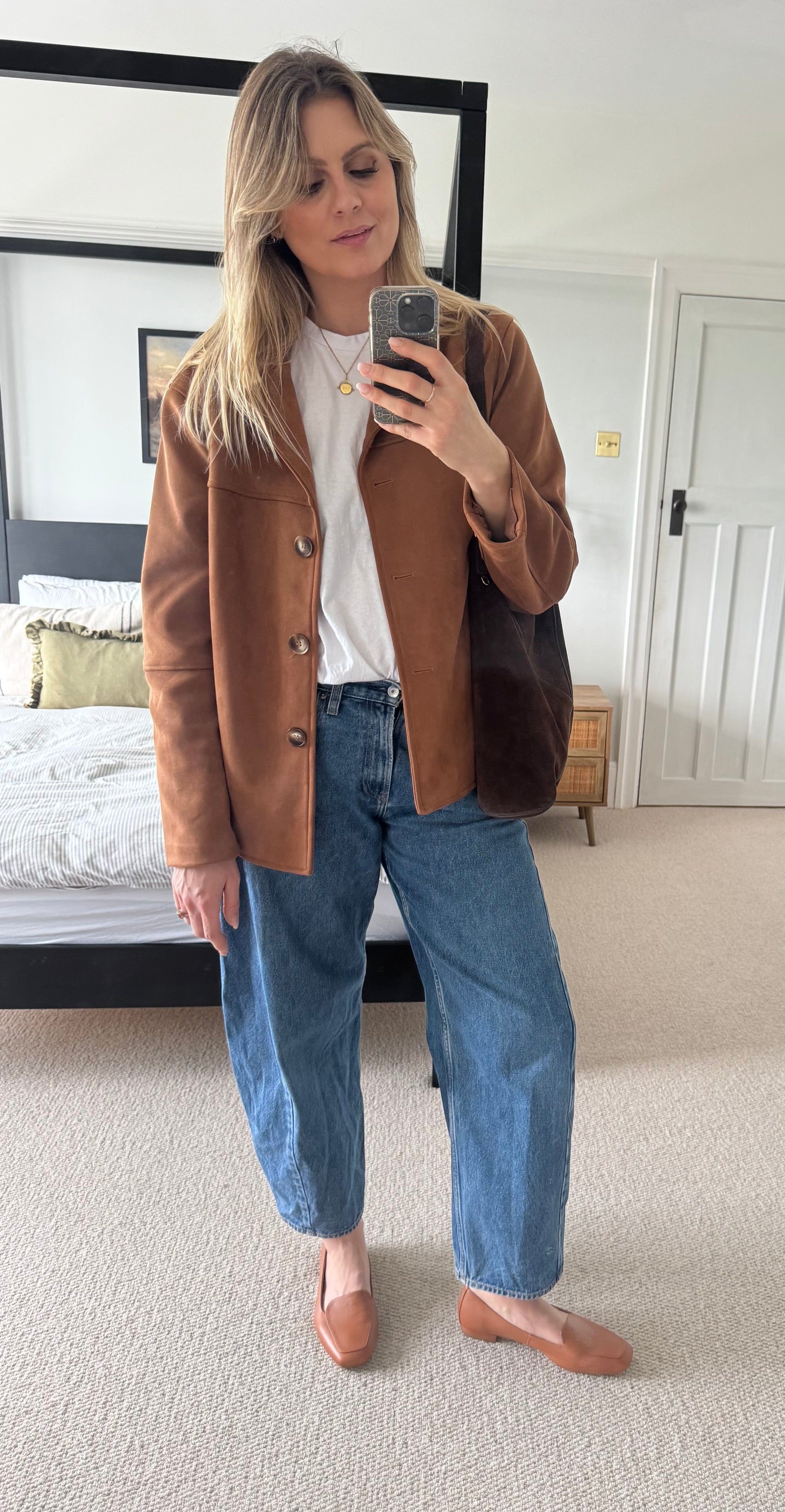 Tall woman modelling tan leather womens loafer in larger sizes 8-12, standard and wide fit