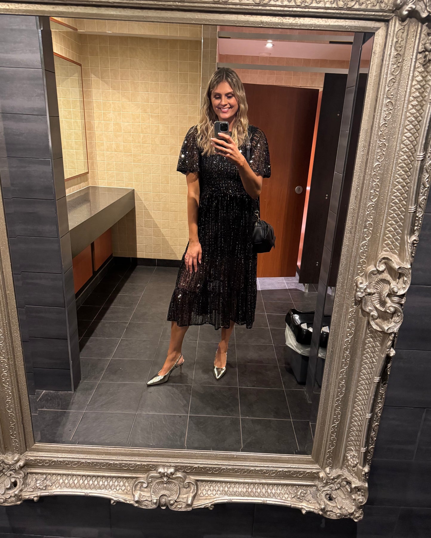 Tall woman modelling gold large sized slingback heels in UK size 9