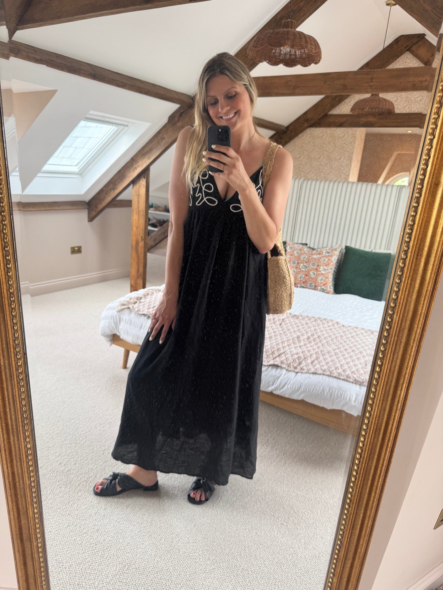 Tall woman wearing black size 9 sandals