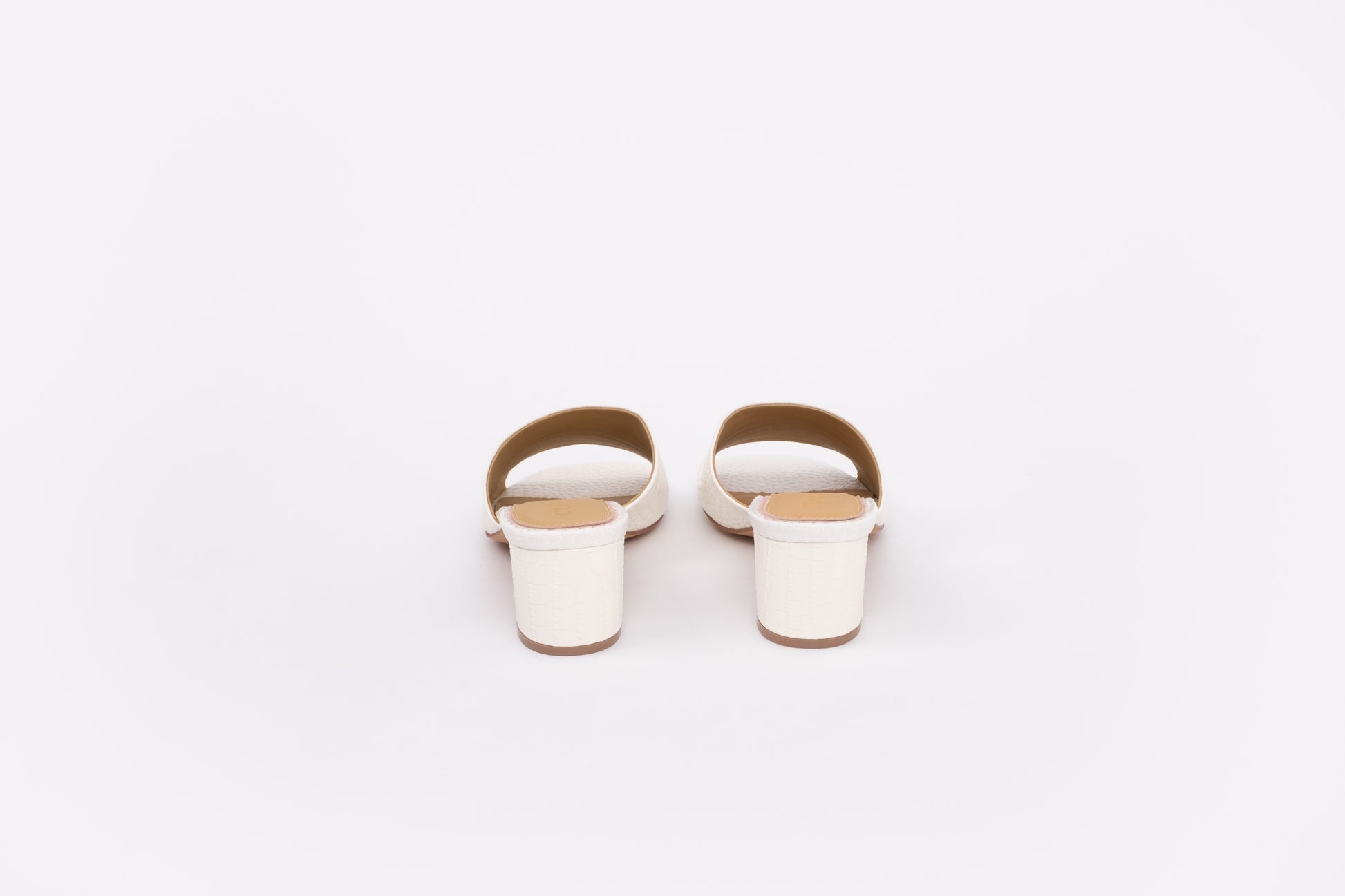 Back shot of cream leather heeled sandals available in larger womens sizes 42-46