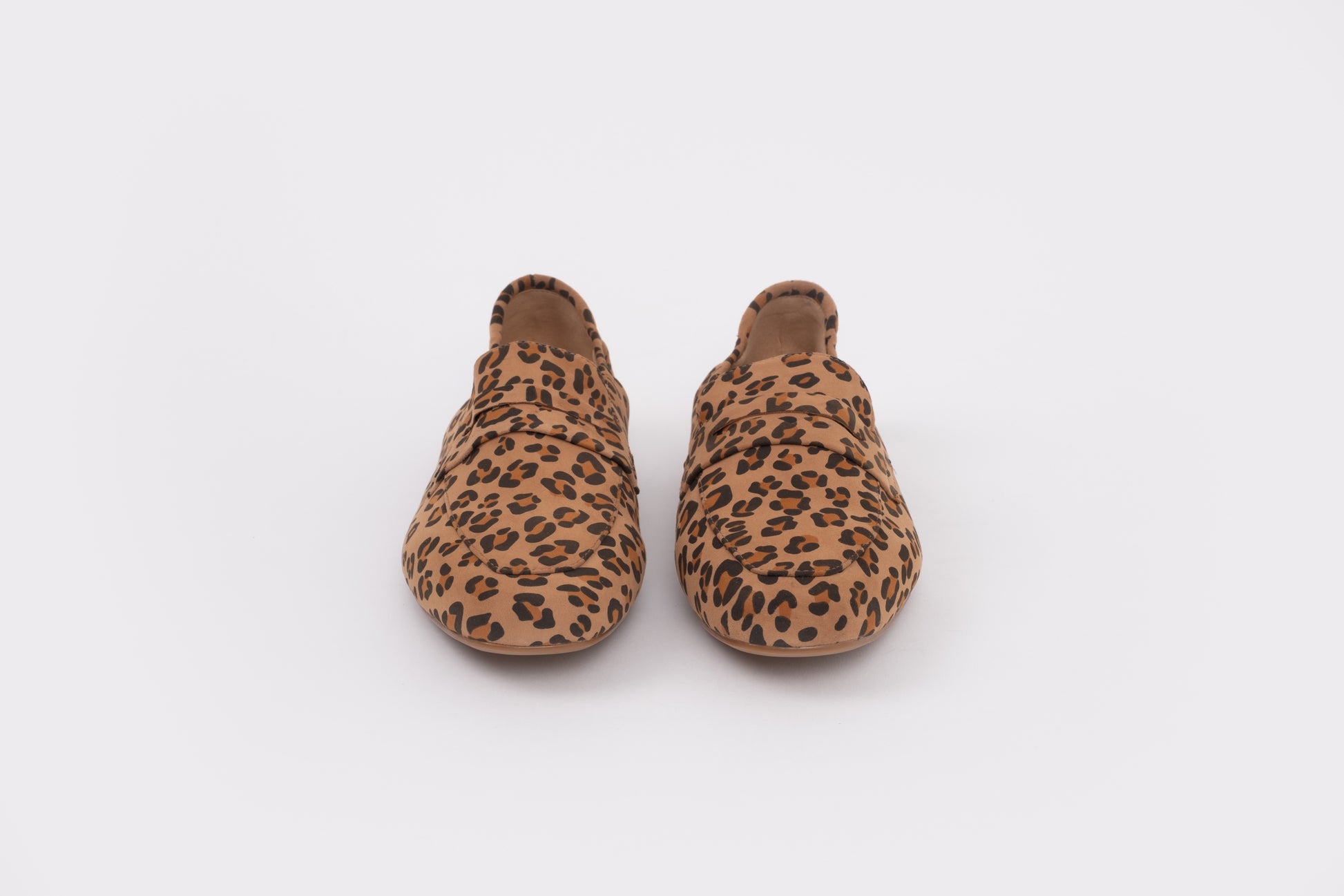 Size 9 womens Pair of leopard print slippers on a white background