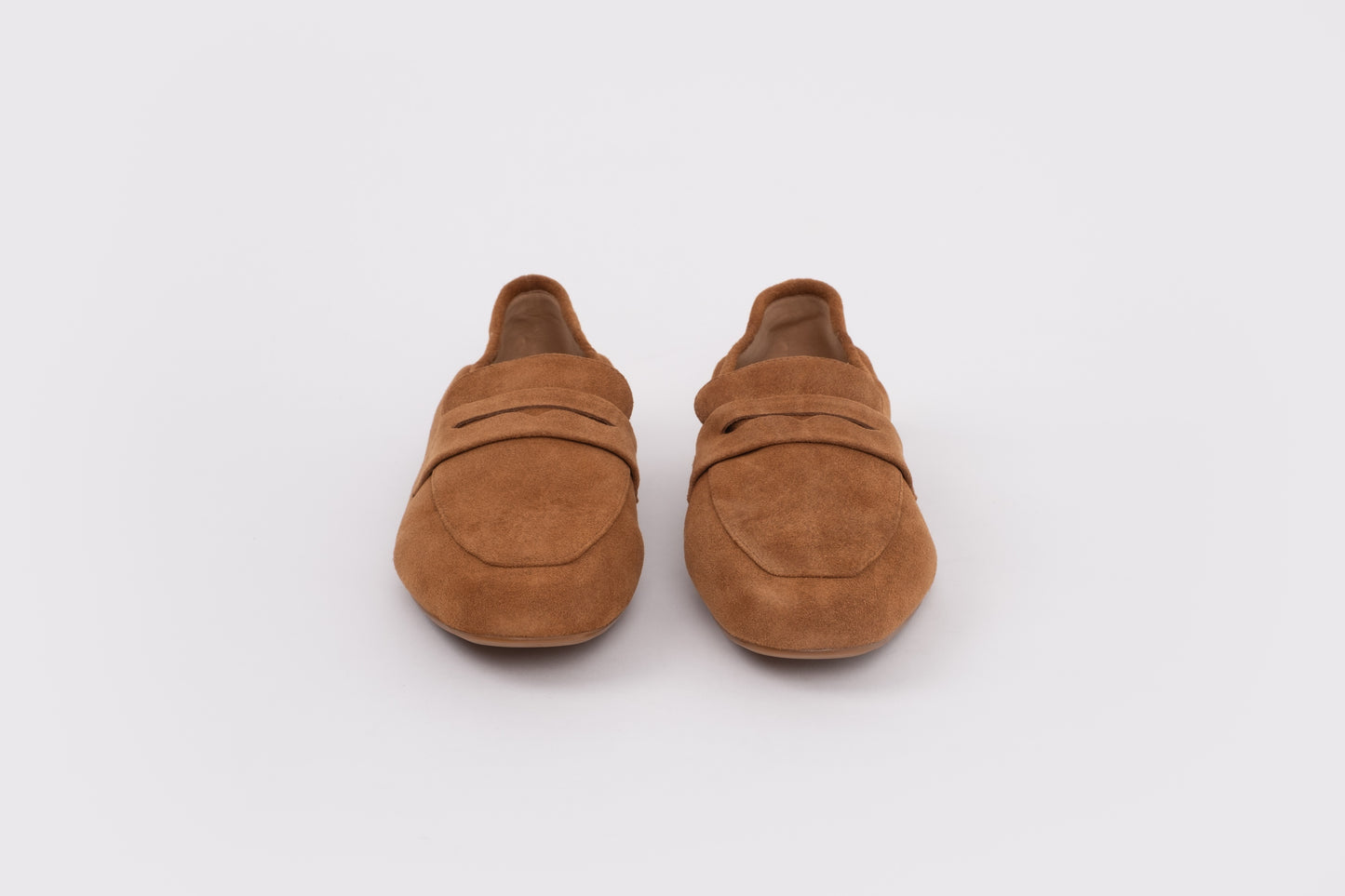 Size 43 womens Pair of brown loafers on a white background