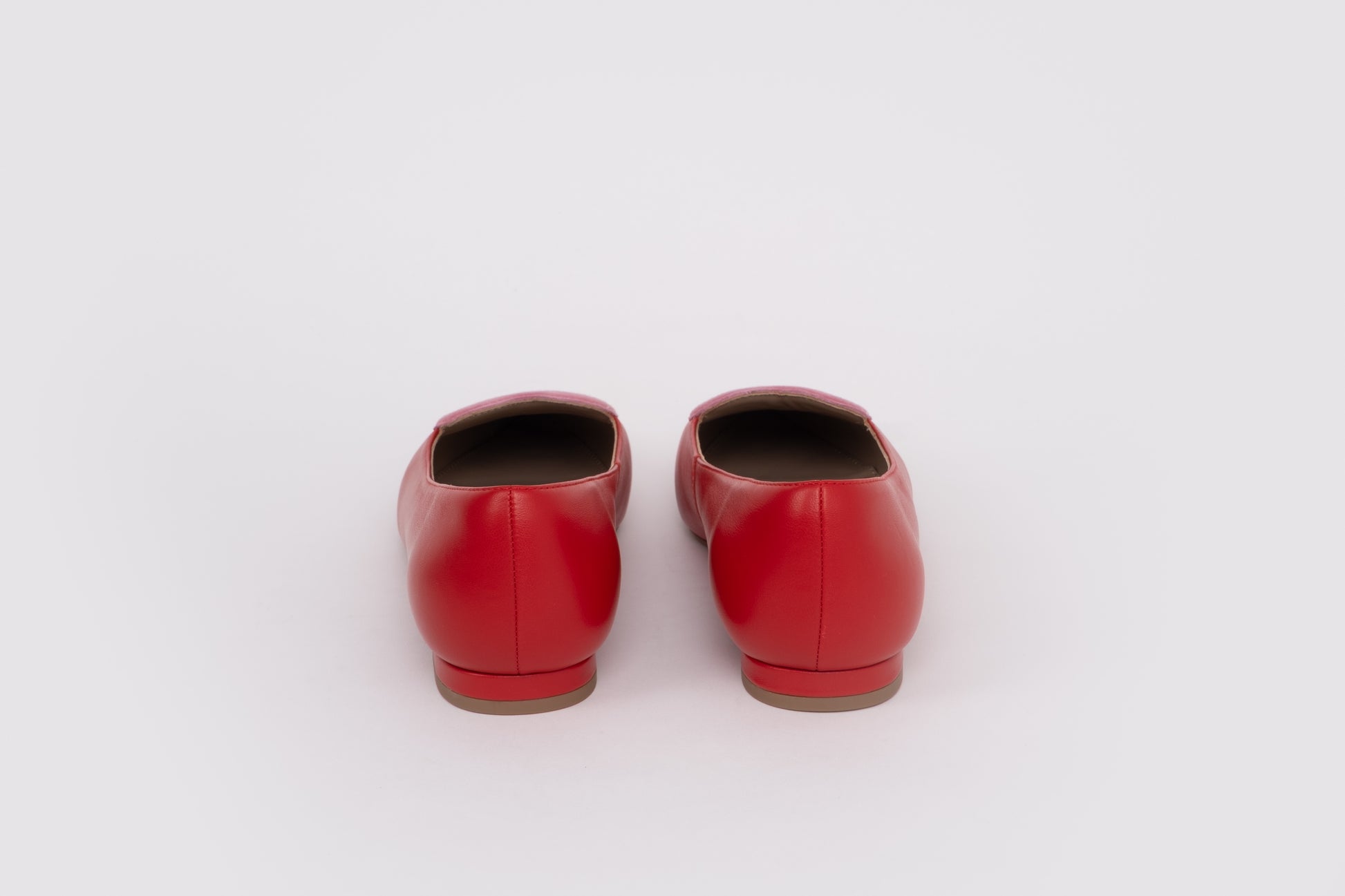 Back shot of womens red pink flat shoes in larger sizes 42-46