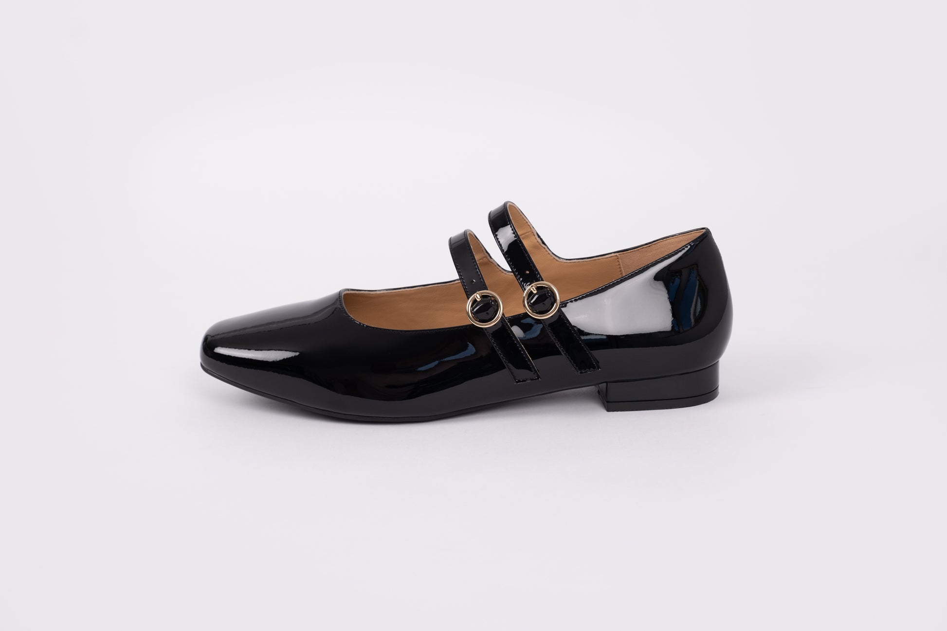 side profile of Jemima flat in black gloss. WOmens flat shoe available in European larger sizes 42-46