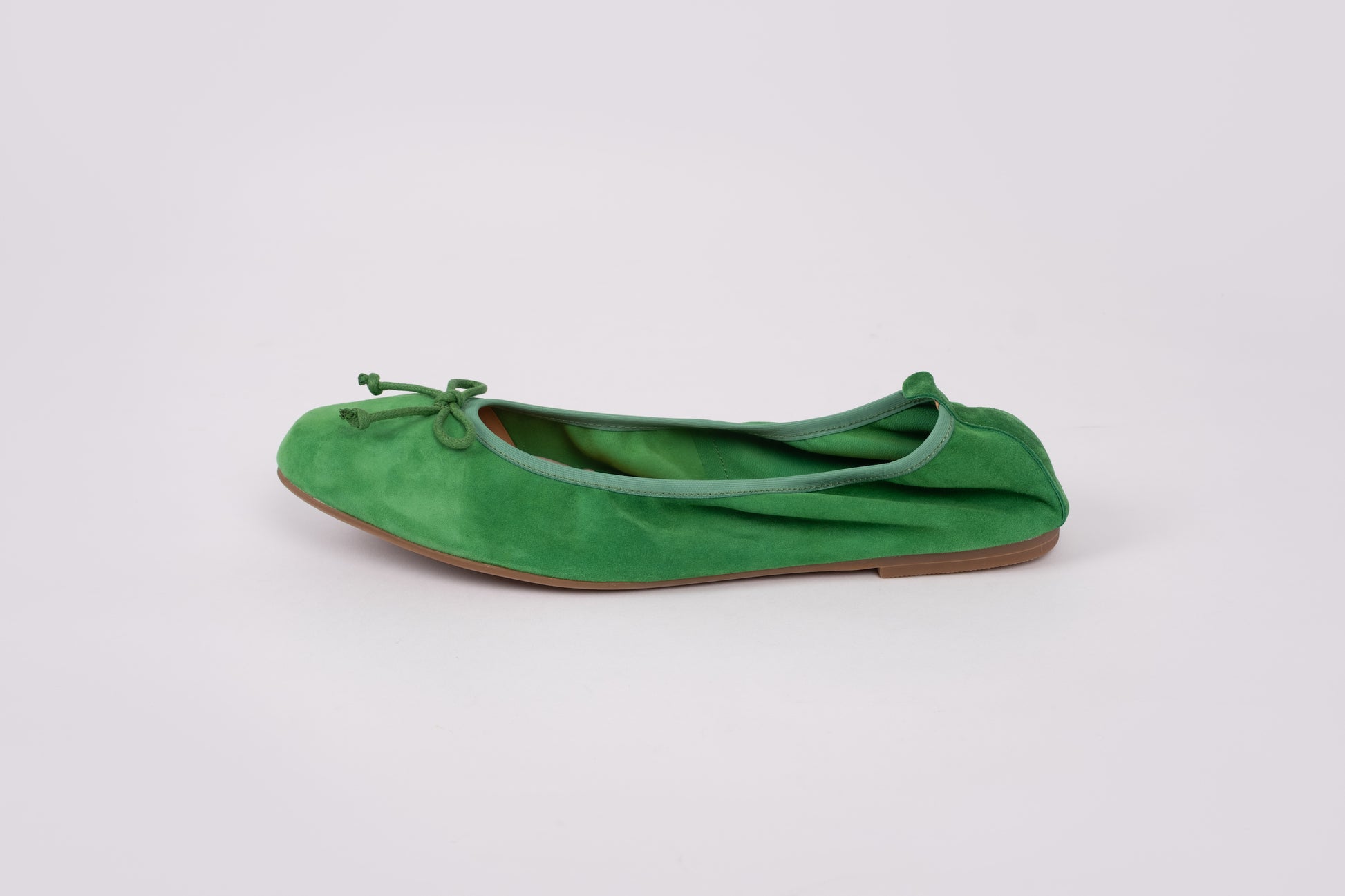 Side profile of Olivia flat in emerald. An elasticated womens shoe available in larger womens sizes UK 8-12