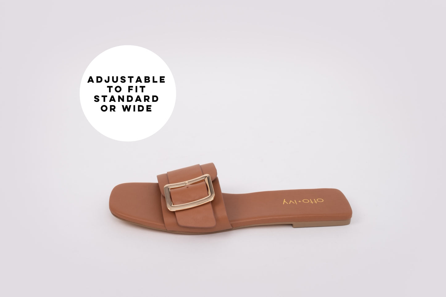 Side profile of tan coloured slide on sandal with adjustable strap for standard and wide fit. Available in womens larger European sizes 42-46