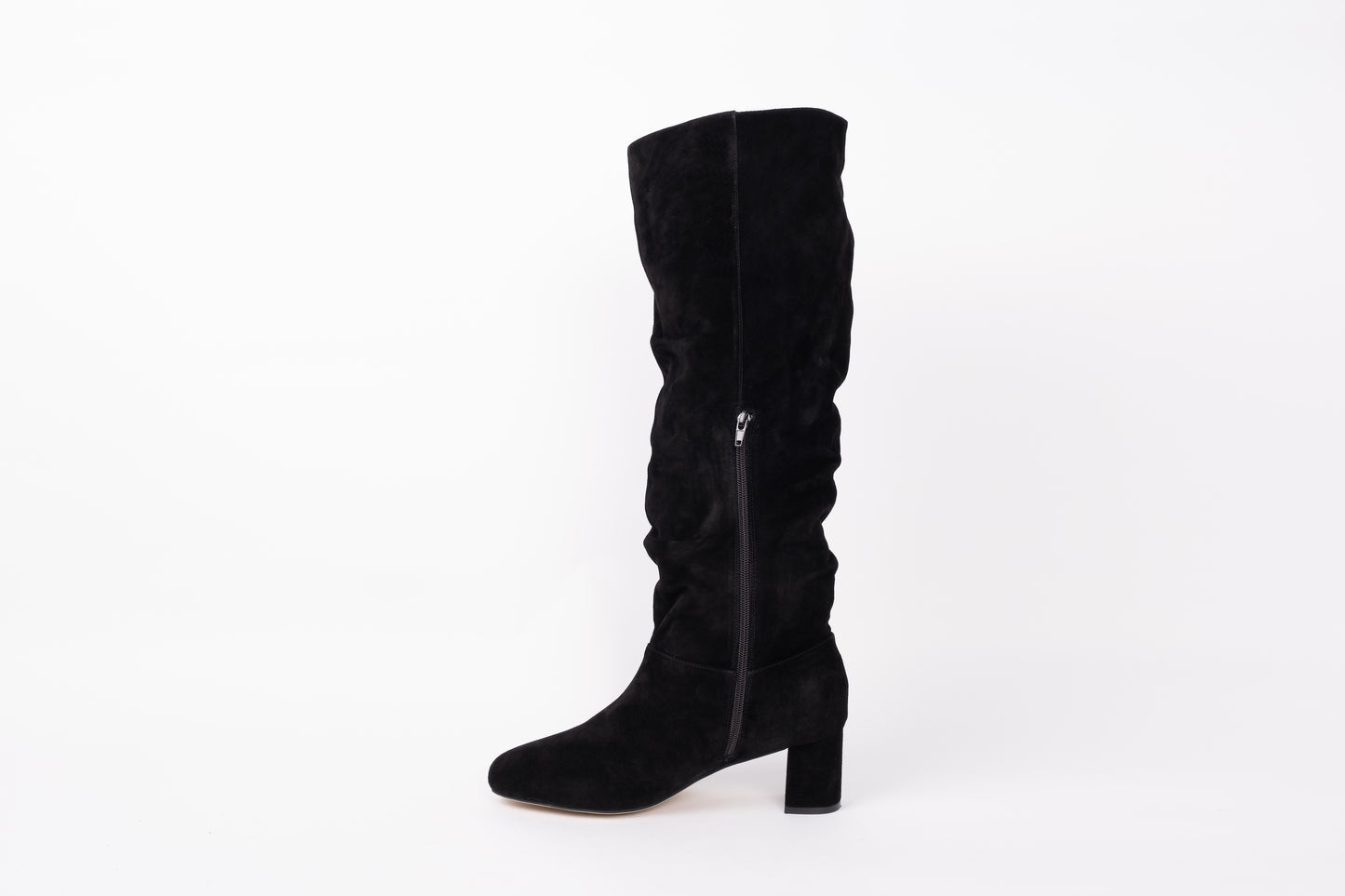 Opposite side profile of Evelyn boot displaying zip. Slouch knee high suede boot with heel. Available in European sizes 42-46