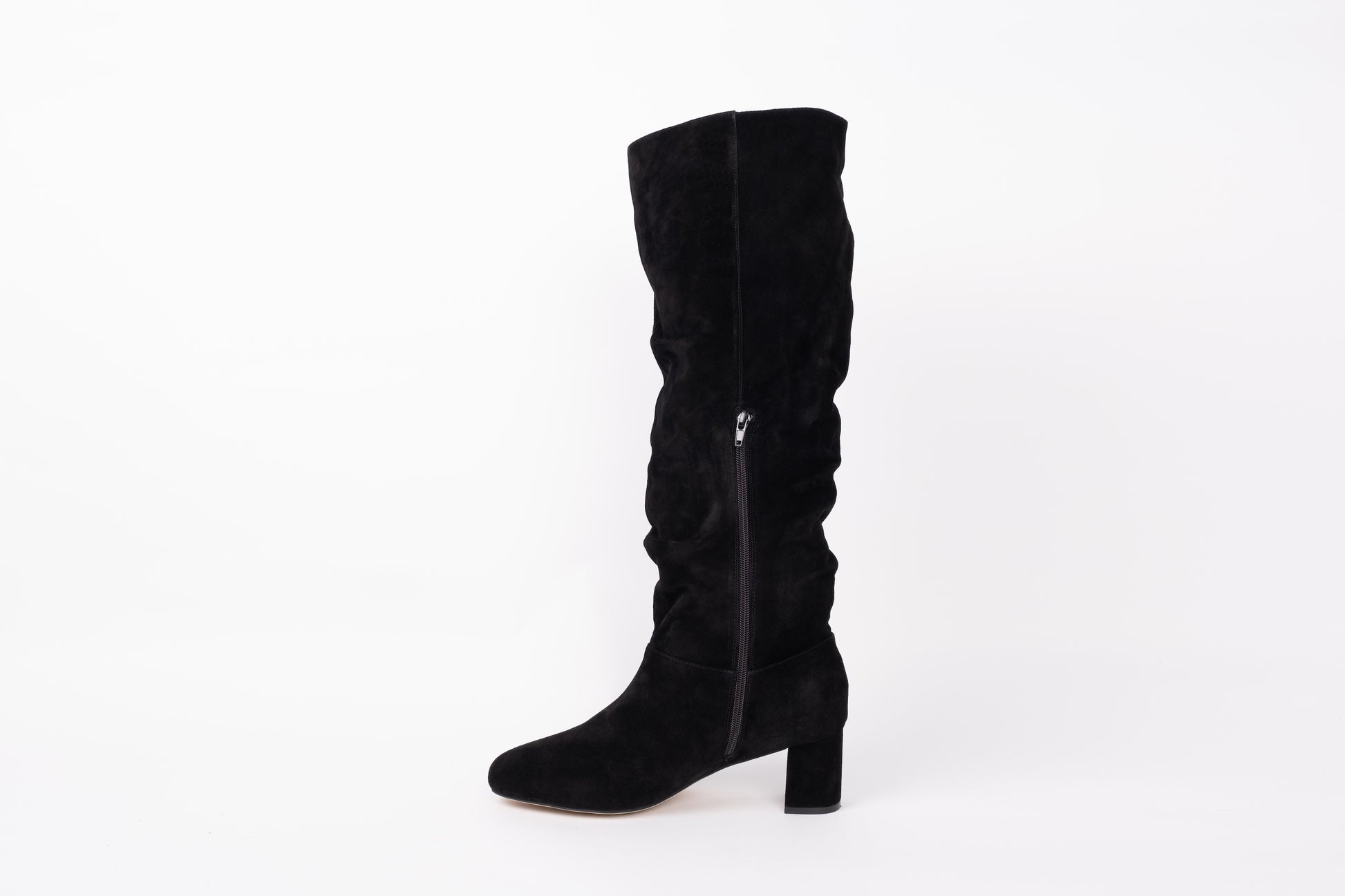 Opposite side profile of Evelyn boot displaying zip. Slouch knee high suede boot with heel. Available in European sizes 42-46