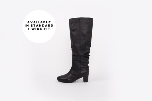 Large sized womens knee high black leather heeled boot available in larger sizes, standard and wide fit.