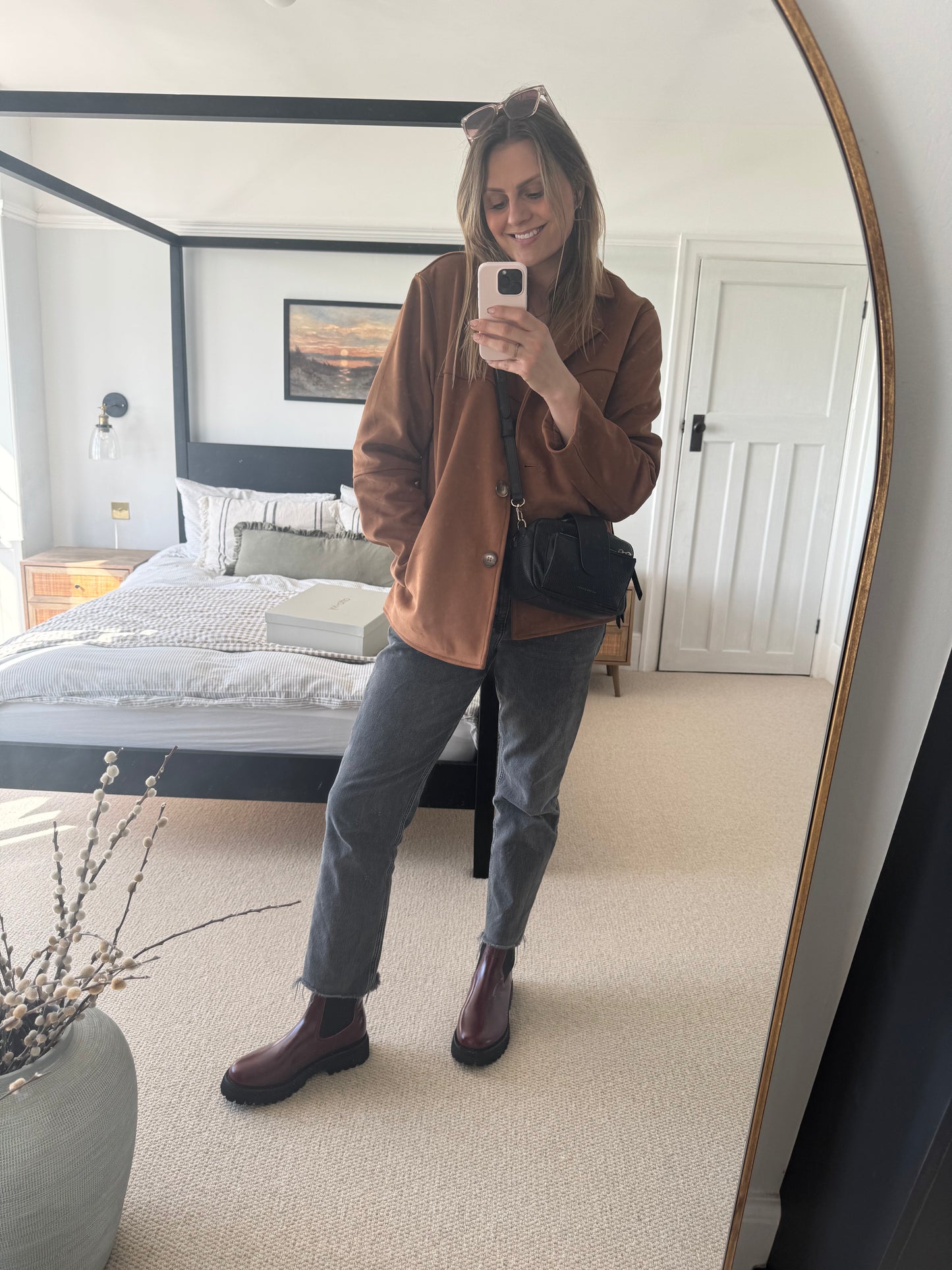 Tall woman modelling oxblood red leather Chelsea boots available in larger sizes es 8-12 and 42-46