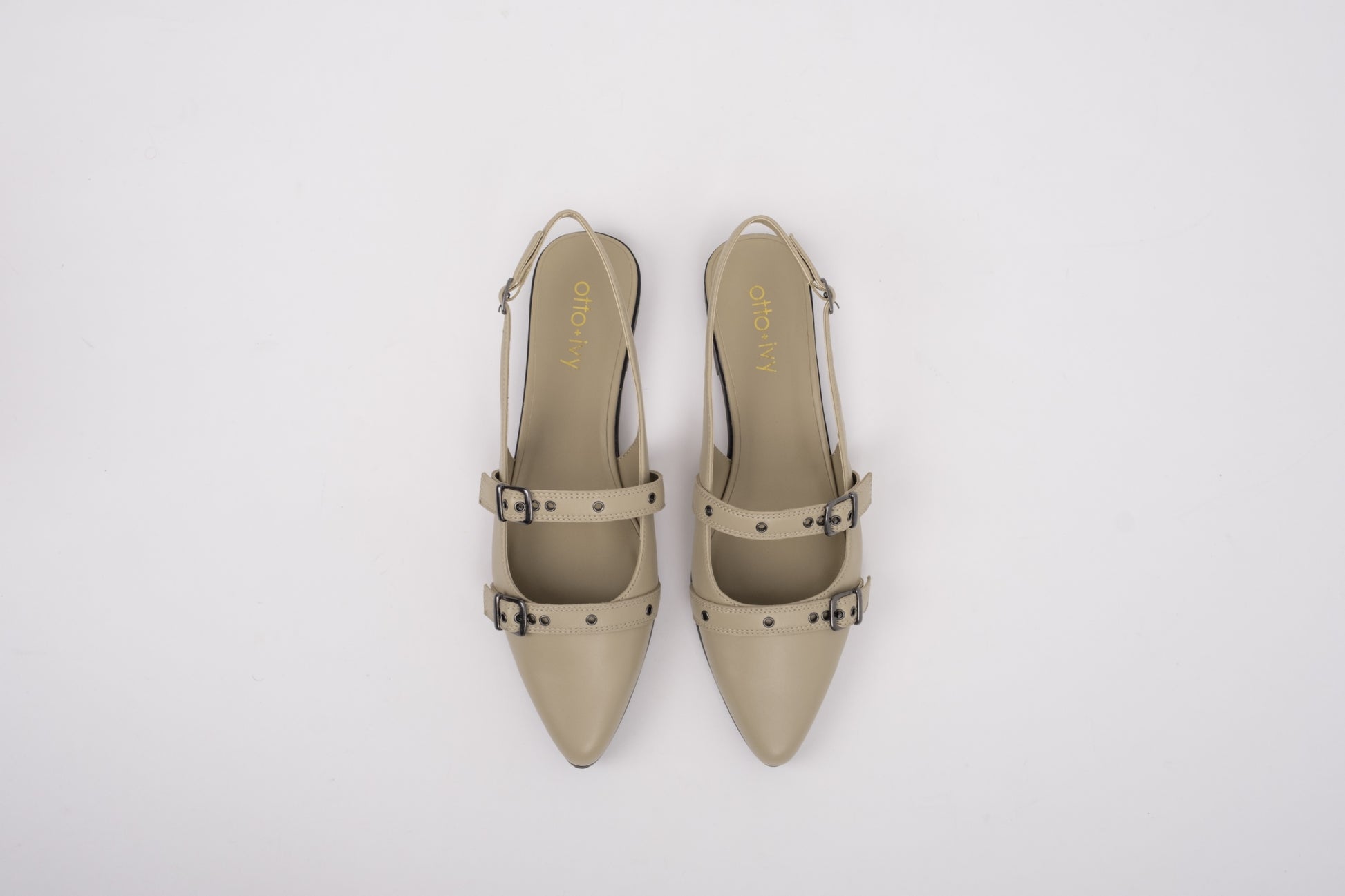 Aerial shot of womens large size beige leather flat slingback shoes in sizes 8 9 10 11 12