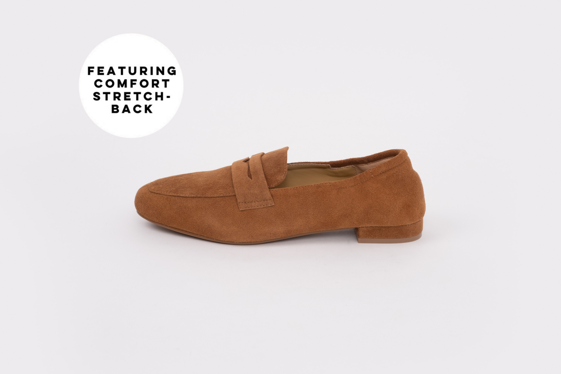 Brown loafer shoe on a white background with text 'Featuring Comfort Stretch'. 
