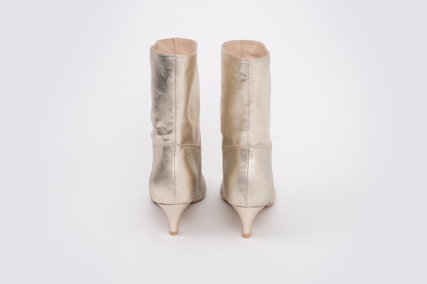 Back shot of womens gold boots in larger sizes 8-12