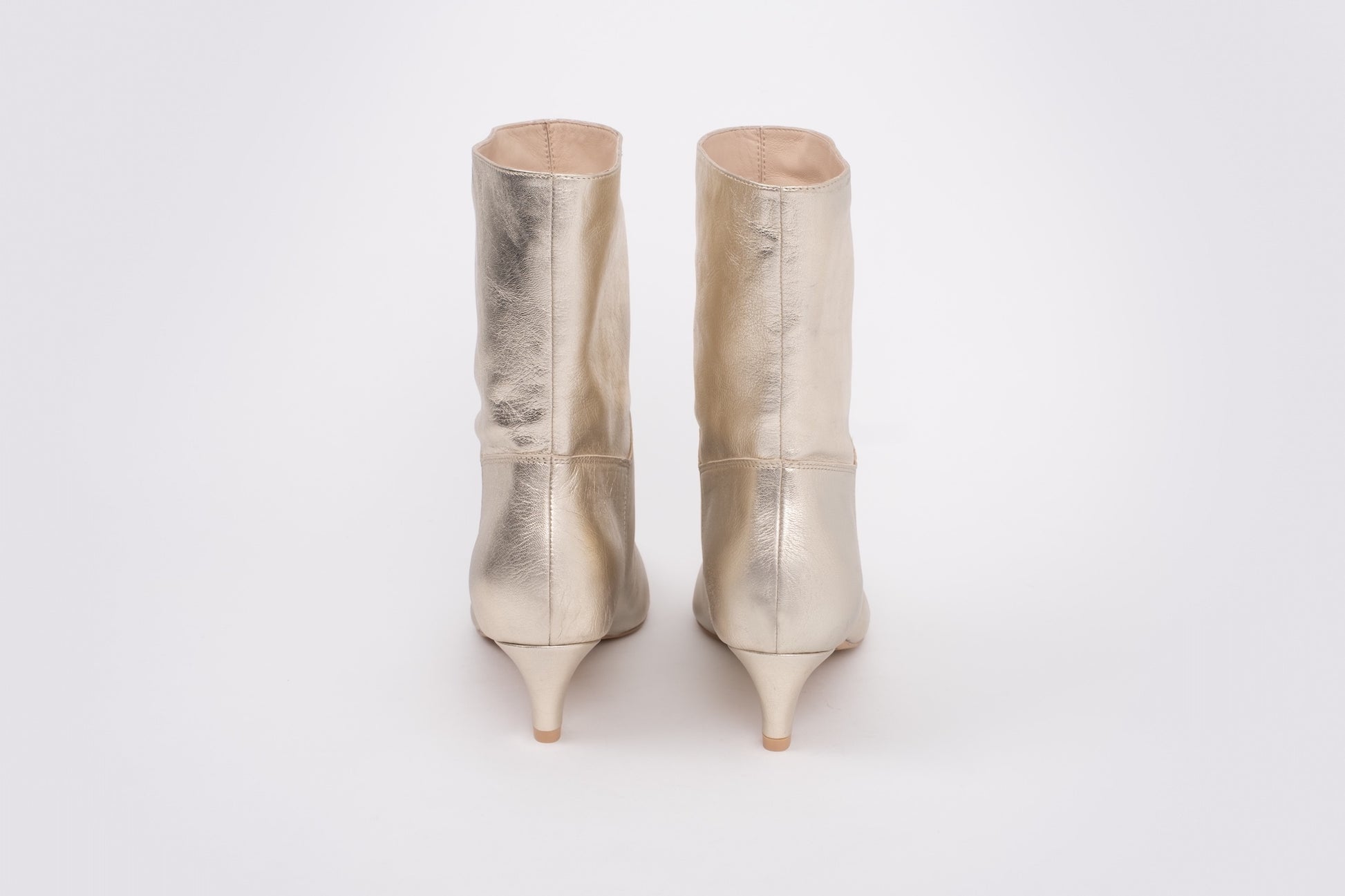 Back shot of womens gold boots in larger sizes 8-12