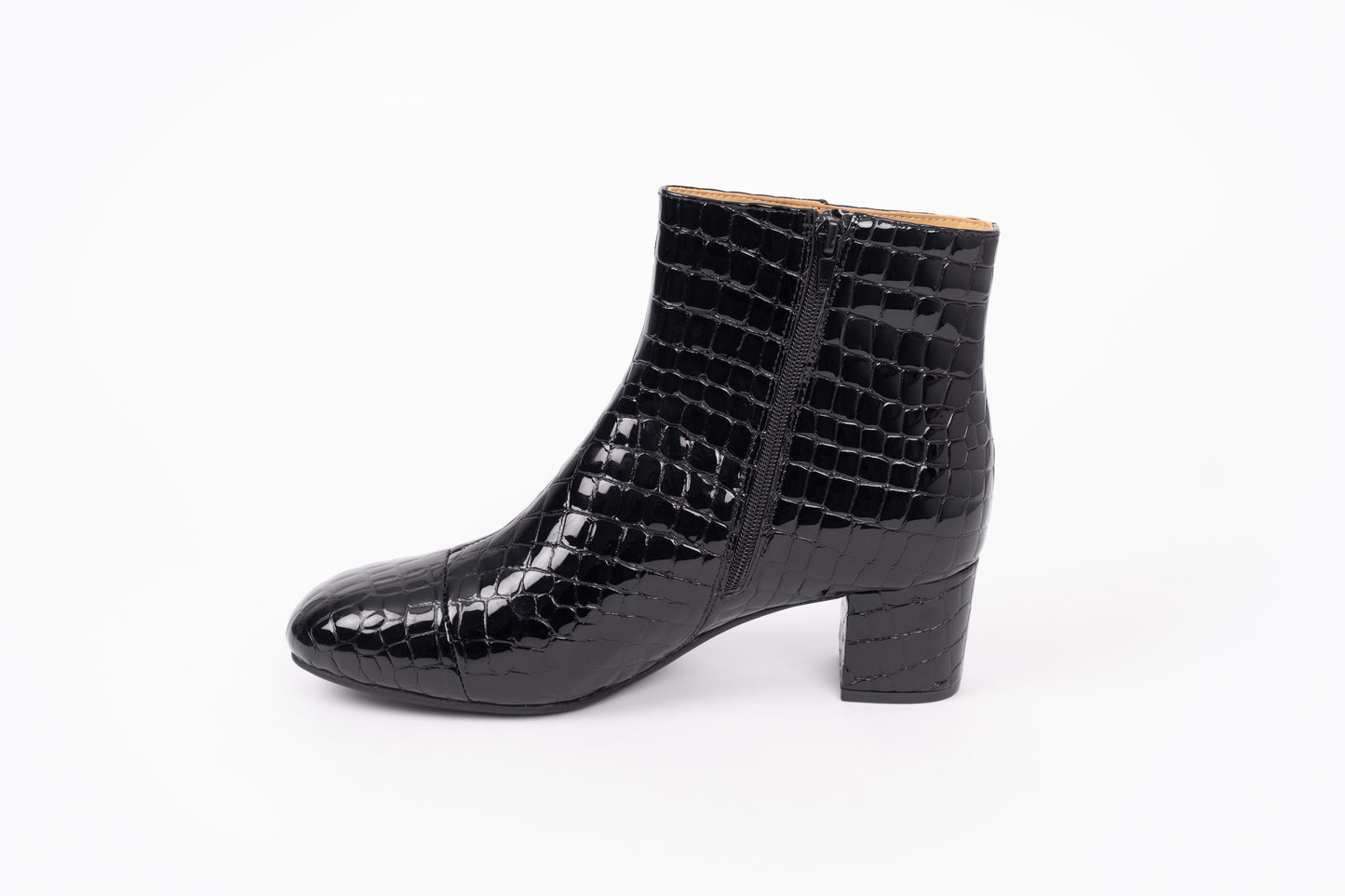 Izzy Boot by Otto + Ivy - a side profile of a black boot for tall women with large feet, featuring glossy black croc leather, side-zip and a low chunky heel.